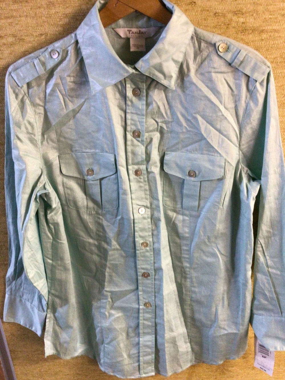 New with tag women’s size 6P metallic teal blouse